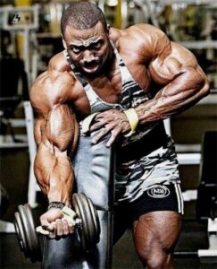 imgi_106_Cedric-McMillan-training-his-arms-in-the-gym-406×502